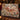 Old Saint Nicks Woodland Mail Route woven blanket draped over a sofa in a holiday living room