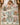 Child sleeping under a Vintage Steamboat Mickey and Minnie mint pink Christmas village fleece blanket on a bed