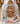 Child sleeping under a Vintage Steamboat Mickey and Minnie gingerbread mansion Christmas fleece blanket on a bed