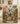 Woman holding a personalized Vintage Steamboat Mickey and Minnie Christmas glasshouse fleece blanket with custom name