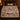 Grist Mill Sleigh & Skating Pond woven blanket spread across a bed in a Christmas bedroom