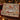 Grist Mill Sleigh & Skating Pond woven blanket draped over a sofa in a holiday living room