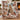 Moose Hollow Cabin Christmas woven blanket draped over an armchair by the fireplace