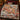 Santas Tinsel Toymaker Workshop woven blanket spread across a bed in a Christmas bedroom