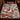 Snowman Sledding Hill Cocoa Day woven blanket spread across a bed in a Christmas bedroom
