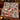 Snowman Sledding Hill Cocoa Day woven blanket draped over a sofa in a holiday living room