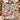 Couple holding a personalized Snowman Sledding Hill Cocoa Day woven blanket with custom family name