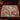 Cardinal Winterberry Snow Garden woven blanket spread across a bed in a Christmas bedroom