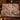 Cardinal Winterberry Snow Garden woven blanket draped over a sofa in a holiday living room