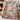 Nutcracker Snowflake Pinewood woven blanket draped over an armchair by the fireplace