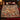 Grandmas Fireside Woodland Homecoming woven blanket spread across a bed in a Christmas bedroom