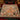 Gingerbread Cottage Squirrel Bakery woven blanket spread across a bed in a Christmas bedroom