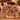 Iced Gingerbread Christmas photo blanket with seven family photos spread on a bed