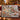 Evergreen Woodland Christmas Gathering woven blanket draped over a sofa in a holiday living room
