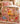 Classic Winnie the Pooh Sweet Shop Christmas fleece blanket spread across a bed in a cozy bedroom