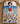 Child sleeping under a personalized Snoopy and Peanuts Gang Starlit Doghouse Christmas fleece blanket with custom name