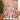 Snoopy and Peanuts Gang Pink Christmas Skating Party fleece blanket spread across a bed in a cozy bedroom