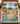 Snoopy and Peanuts Gang Aloha Beach Christmas fleece blanket spread across a bed in a cozy bedroom