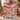 Woman holding a personalized Grinch Christmas Gift-Wrap fleece blanket with custom name by the Christmas tree