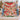 Couple holding a personalized Grinch Christmas Gift-Wrap fleece blanket with custom names