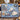 Blue Tartan Polar Bear Starlight woven blanket draped over a sofa in a holiday living room