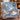 Blue Tartan Polar Bear Starlight woven blanket draped over an armchair