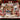 Scandi Paper Star Christmas photo blanket with family photos spread on a bed