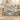 Camellia & Blue Tits woven blanket draped over a sofa in a bright living room