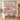 Personalized Poppy & Moth Reverie quilt with sample family name hung on a wall above a bench with 2 matching pillowcases