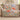 Poppy & Moth Reverie woven blanket draped over a sofa in a neutral living room