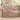 Poppy & Moth Reverie woven blanket draped over a sofa in a bright living room