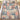 Grammy Toile Grandma Garden Patchwork woven blanket with grandkids names spread on a bed