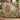Porcupine Quill Letter Garden woven blanket draped over a sofa in a warm living room