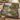 Buttonbush Mill Race woven blanket draped over a sofa in a warm living room