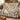 Tulip Tree Flying Squirrel woven blanket draped over a sofa in a warm living room
