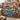 Everglades Spoonbill Dusk woven blanket draped over a sofa in a warm living room