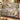 Luna Moth Moonflower Garden Gate woven blanket draped over a sofa in a warm living room