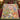 Grandma's Garden hummingbird fleece throw with custom names on a bed