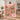 Personalized A Thousand Little Joys pet memorial fleece blanket with custom photos and the name BELLA, held up in a living room