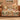Golden Terracotta Meadow: Terracotta floral woven blanket on a sofa, with six name patches and a Grammie plaque reading "Our love is stitched together."
