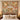 Golden Terracotta Meadow: Terracotta floral woven blanket hanging on a wall, with six name patches and a Nana & Papa plaque reading "Together is our happy place."