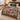 Hearthside Christmas patchwork woven blanket with tartan and holly patches spread across a bed in a festive bedroom
