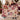 Couple holding a personalized Rosewood Keepsakes Christmas patchwork woven blanket with a sample family name