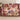 Rosewood Keepsakes Christmas patchwork woven blanket with nutcracker, teddy bear and tinsel tree patches draped over a sofa