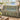 Birch Lake Wildflower Meadow woven blanket draped over a sofa by a lake view window