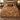 Terracotta Acanthus Hearth Morris Style woven blanket spread across a bed in a cozy bedroom