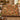 Terracotta Acanthus Hearth Morris Style woven blanket draped over a sofa in a warm living room
