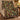 Indigo Thrush Bramble Thief Morris Style woven blanket draped over an armchair