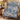 Garden Folly Blue woven blanket draped over an armchair