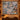 Alpine Ibex Christmas woven blanket displayed as a wall tapestry above a console